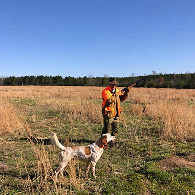  <h2>Blue Skies of Alabama</h2><p>Jeff Ferguson of Section, Alabama sent in this photo with the caption "GOOD DOG! Flash is on his game. He has a bird in his mouth and manages to point a second bird at the same time-----good show! His friend in the field is Jim Miller of Birmingham, Alabama."</p>
