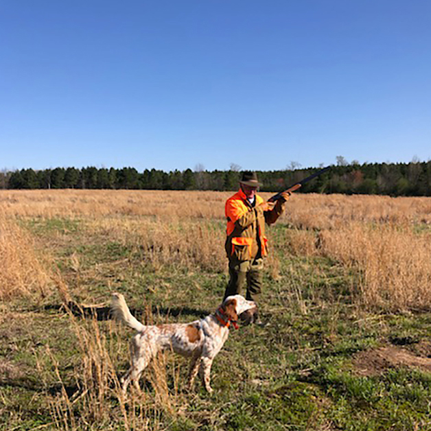  <h2>Blue Skies of Alabama</h2><p>Jeff Ferguson of Section, Alabama sent in this photo with the caption "GOOD DOG! Flash is on his game. He has a bird in his mouth and manages to point a second bird at the same time-----good show! His friend in the field is Jim Miller of Birmingham, Alabama."</p>
